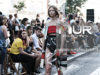 A model parades with design by Maria Lafuente during the MFW - Madrid Fashion Week in the street of the neighborhood of La Latina. September...