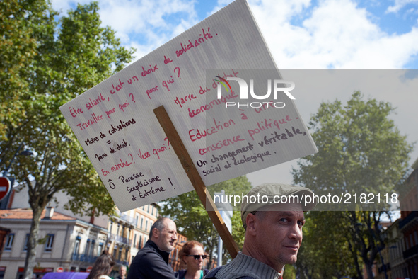 A protester holds a placard with propositions different of the Macron reforms.More than 10000 protesters took to the streets of Toulouse aga...