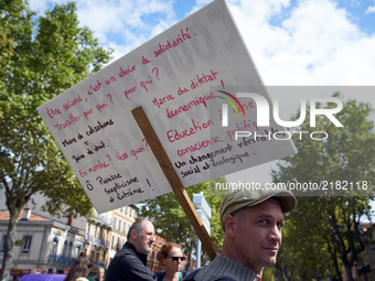 A protester holds a placard with propositions different of the Macron reforms.More than 10000 protesters took to the streets of Toulouse aga...