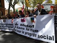 A banner reading 'no to the MEDEF's program ; in firms and in the streets, employed and youths united for social progress'. More than 10000...