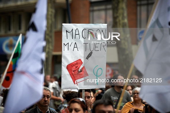 A placrd reading 'Macron kill me' with a Work Code stabbed. More than 10000 protesters took to the streets of Toulouse against the new Macro...