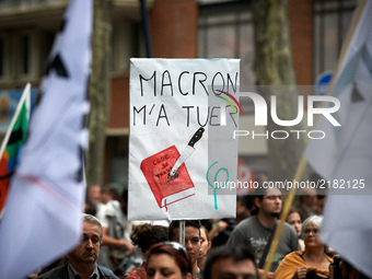 A placrd reading 'Macron kill me' with a Work Code stabbed. More than 10000 protesters took to the streets of Toulouse against the new Macro...