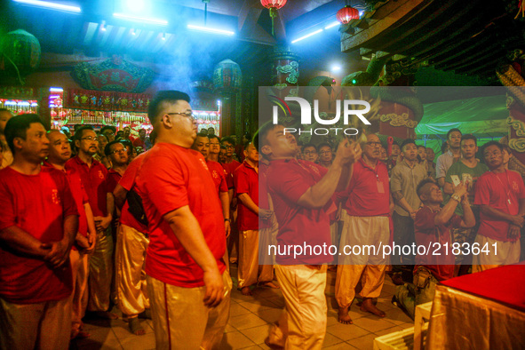 Ethnic Chinese perform  a special prayer during the Hungry Ghost Festival in Teluk Pulai Klang, Malaysia on September 12, 2017. 
