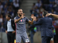 Besiktas' forward Cenk Tosun celebrates after scoring a goal with Besiktas' head coach Senol Gunes during the FC Porto v Besiktas - UEFA Cha...