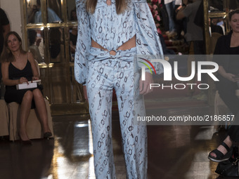 A model takes to the catwalk with a creation for Spring-Autunm 2018 Collection of Palomo Spain label during the first day of the Madrid Fash...
