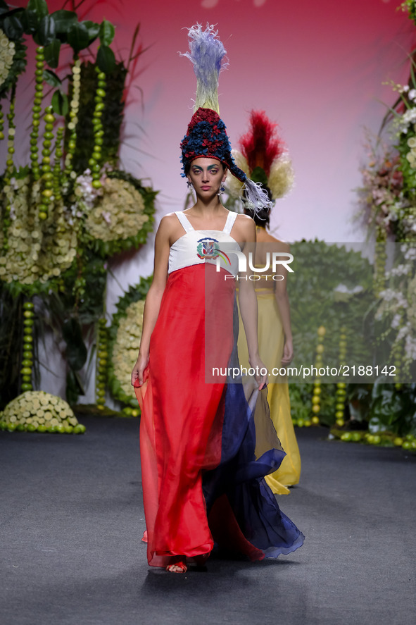 A model takes to the catwalk with a creation for Spring-Autunm 2018 Collection of  Francis Montesinos during the first day of the Madrid Fas...