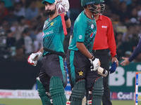Pakistani batsman Ahmed Shahzad waves the bat affter scoring 50 runs during the third and final Twenty20 International match between the Wor...