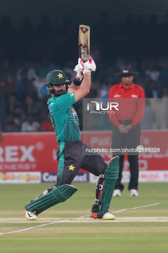 Pakistani batsman Ahmed Shahzad hits a shot during the third and final Twenty20 International match between the World XI and Pakistan at the...