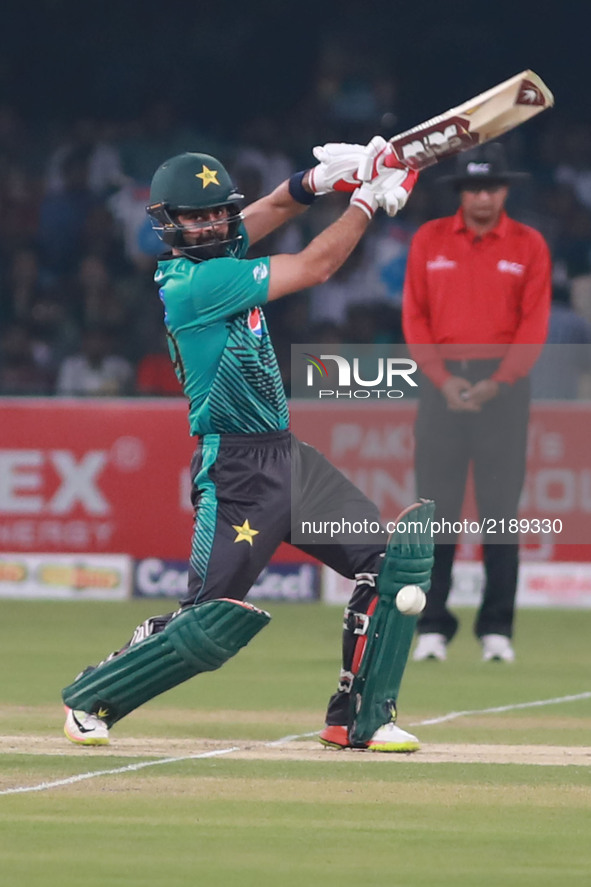 Pakistani batsman Ahmed Shahzad hits a shot during the third and final Twenty20 International match between the World XI and Pakistan at the...