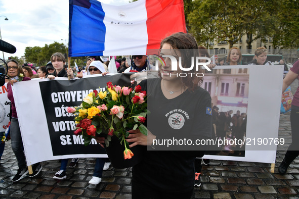 People attend a protest march demanding better means for French police officers on September 16, 2017, in Paris, one year after an increased...