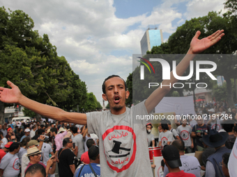 A protester shouts slogans and raise his arms as he attends a march held under the slogan ‘firmness against the mafia regime’ by the movemen...