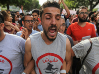 A protester shouts slogans during a march held under the slogan ‘firmness against the mafia regime’ by the movement "I don't forgive" (Manic...