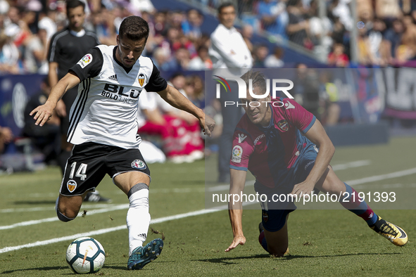 14 Jose Luis Gaya of Valencia CF (L) in action against 27 Jorge Ruiz Ojeda, Koke, of Levante Ud during spanish La Liga Santander match betwe...