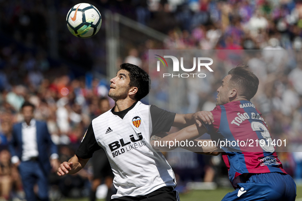 18 Carlos Soler of Valencia CF (L) in action against 03 Antonio Garcia Aranda, Tono, of Levante Ud  (R) during spanish La Liga Santander mat...