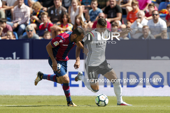 19 Pedro Lopez of Levante Ud (L) in action against 11 Andreas Hugo Hoelgebaum Pereira (R) during spanish La Liga Santander match between Lev...