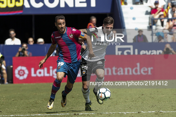 19 Pedro Lopez of Levante Ud (L) in action against 22 Santi Mina of Valencia CF during spanish La Liga Santander match between Levante UD an...