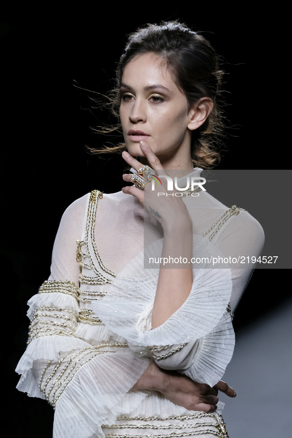 A model takes to the catwalk with a creation for Spring-Summer 2018 Collection of TERESA HELBIG during of the Madrid Fashion Week, in Madrid...