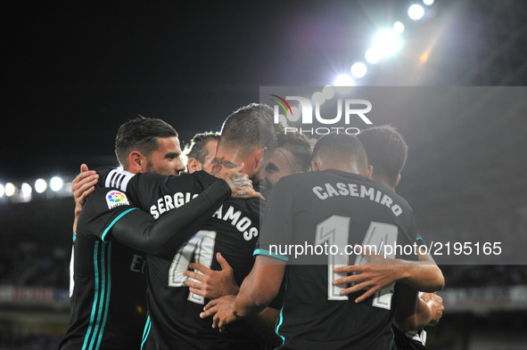 Real Madrid players celebrate their first goal during the Spanish league football match Real Sociedad vs Real Madrid CF at the Anoeta stadiu...