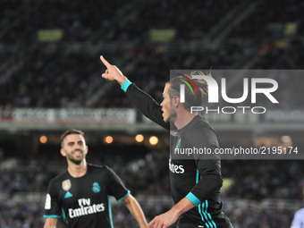 Bale of Real Madrid celebrates with teammates after scoring during the Spanish league football match between Real Sociedad and Real Madrid a...