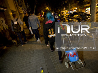 Members of the Popular Unity Candidature (CUP), distribute campaign posters in the popular district of Nou Barris, Barcelona, asking for the...