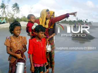 Rohingyas cam on a boat at stahparir dwip of teknaf in Cox's Bazar, Bangladesh on 15 September 2017. Around 370,000 Rohingya refugees have f...