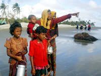 Rohingyas cam on a boat at stahparir dwip of teknaf in Cox's Bazar, Bangladesh on 15 September 2017. Around 370,000 Rohingya refugees have f...
