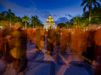 In this long exposure photograph, Monks from Myanmar residing in Sri Lanka engage in a peaceful demonstration to show solidarity with Buddhi...