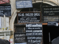 Signs advertising the services of lawyers in the city of Kandy, Sri Lanka. (