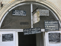 Signs advertising the services of lawyers in the city of Kandy, Sri Lanka. (