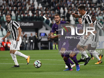 Fiorentina defender Vincent Laurini (2) thwarted by Juventus forward Paulo Dybala (10) during the Serie A football match n.5 JUVENTUS - FIOR...