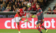 Benficas defender Eliseu from Portugal (L) and Bragas forward Bruno Xadas from Portugal (R...