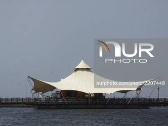 Visitors to activities with family or relatives while traveling in Ancol Beach, North Jakarta, on September 19, 2017. Ancol beach is one of...
