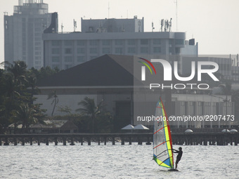Visitors to activities with family or relatives while traveling in Ancol Beach, North Jakarta, on September 19, 2017. Ancol beach is one of...