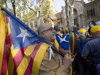 Thousands of pro-independence demonstrators from Catalonia demonstrate in Barcelona against the presence of the Spanish police and in favor...