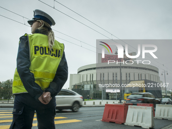 A female police officer is seen near the renonwn opera building in Bydoszcz, Poland on September 22, 2017. (