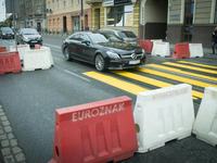 A Mercedes-Benz CLS is seen traversing a makeshift zebra crossing in one of the citys busiest roads on World Car-Free Day on September 22, 2...