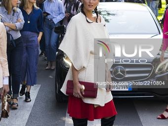A guest attends the Sport Max show during Milan Fashion Week Spring/Summer 2018 on September 22, 2017 in Milan, Italy. (