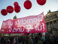 Supporters of the Social Democratic Party (SPD) hold banners during an election rally at Gendarmenmarkt in Berlin, Germany on September 22,...