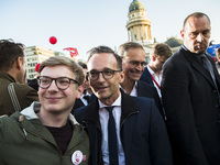 An SPD supporter makes a selfie with German Justice Minister Heiko Maas (C) during an election rally at Gendarmenmarkt in Berlin, Germany on...