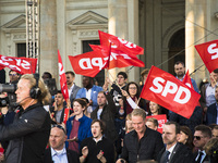 Supporters of the Social Democratic Party (SPD) weaves flags during an election rally at Gendarmenmarkt in Berlin, Germany on September 22,...