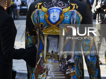 A guest is wearing a Versace before the Versace fashion show during Milan Fashion Week Spring/Summer 2018 on September 22, 2017 in Milan, It...
