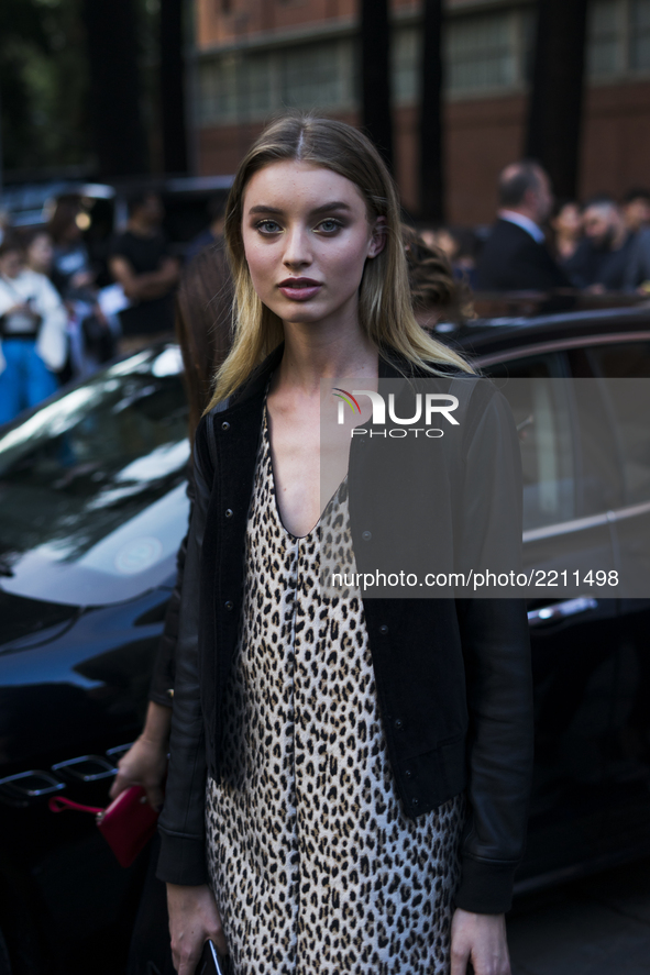 A guest is wearing a Versace before the Versace fashion show during Milan Fashion Week Spring/Summer 2018 on September 22, 2017 in Milan, It...