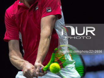 Team World player Sam Querrey of United States returns the ball to Team Europe player Roger Federer of Switzerland during the first day at L...
