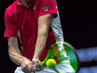 Team World player Sam Querrey of United States returns the ball to Team Europe player Roger Federer of Switzerland during the first day at L...