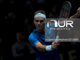 Team Europe player Roger Federer of Switzerland returns the ball to Team World player Sam Querrey of United States during the second day at...