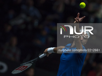 Team Europe player Roger Federer of Switzerland serves against Team World player Sam Querrey of United States during the second day at Laver...