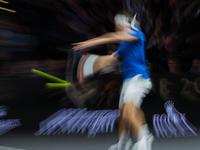 Team Europe player Roger Federer of Switzerland returns the ball to Team World player Sam Querrey of United States during the second day at...