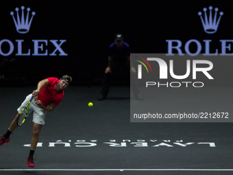 Team World player Jack Sock of United States serves against Team Europe player Rafael Nadal of Spain during the first day at Laver Cup on Se...