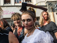 Participants dressed and made up as zombies take part in the 11th edition of the Zombie Walk in the streets of Lyon, France, September 23,...