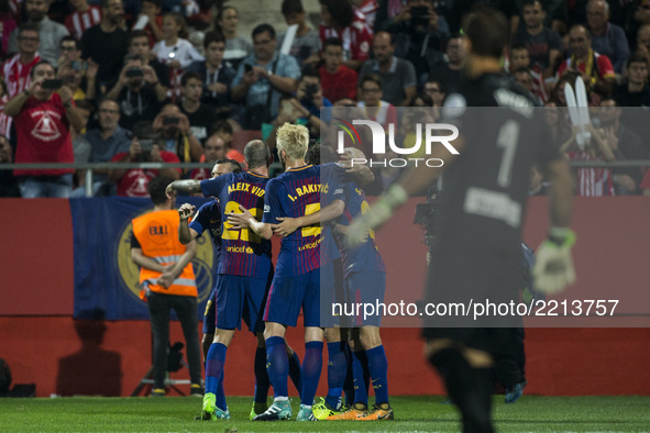 Luis Suarez from Uruguay of FC Barcelona celebrating his goal with the team during the La Liga match between Girona FC v FC Barcelona  at Mo...